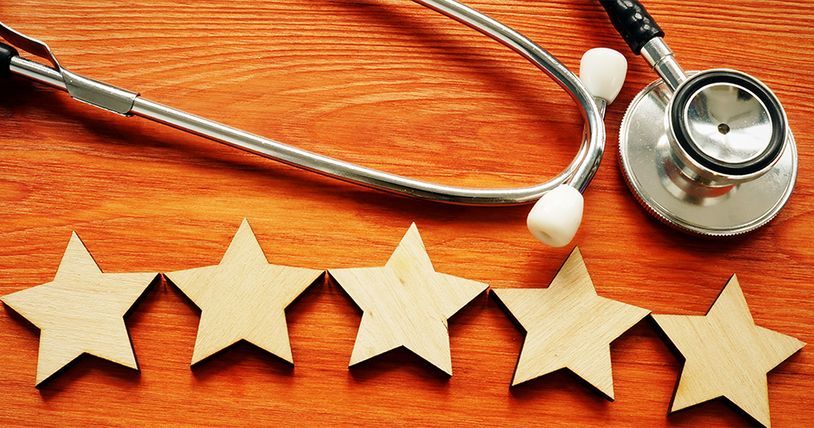 wooden stars next to a stethoscope
