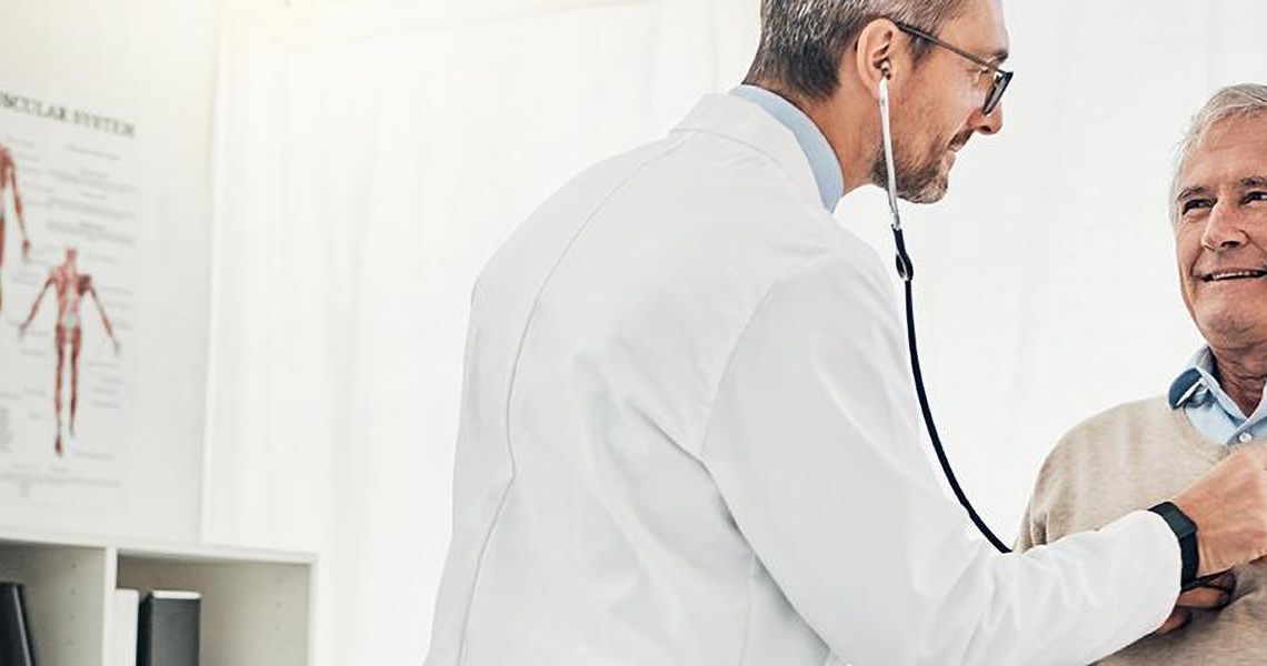 Doctor using a stethoscope on a patient