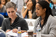 two people sitting in a meeting