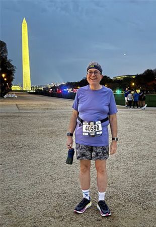Matthew Henry standing on the Mall with the Washington Monument in the background