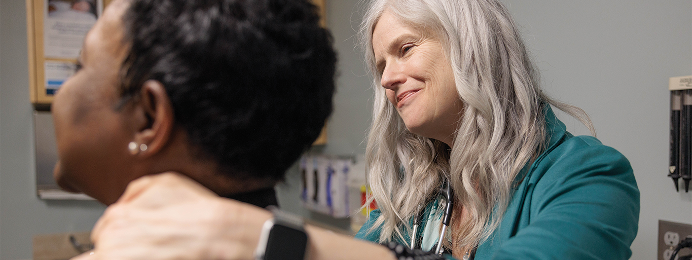 Julie Bauman, MD examines a patient