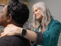 Julie Bauman, MD, examines a patient