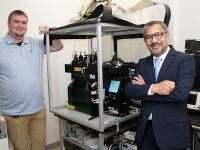 Greg Cresswell (left) with Sanjay Maggiwar (right) with the current flow cytometer