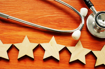 wooden stars next to a stethoscope