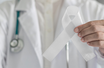 Doctor holding a white ribbon
