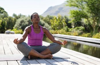An African American woman engaging in mindfulness