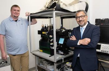 Greg Cresswell (left) with Sanjay Maggiwar (right) with the current flow cytometer