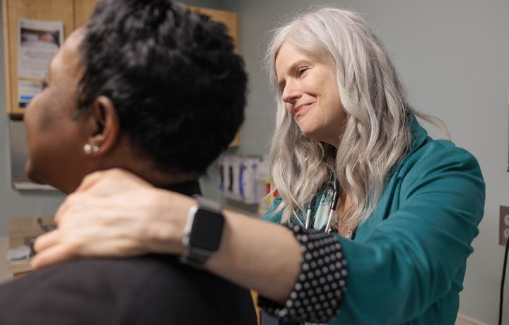 Julie Bauman, MD, examines a patient